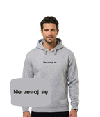 Light gray hoodie with embroidered "Nie zesraj się" text on the front, featuring a hood and casual fit from CustomClothes.pl